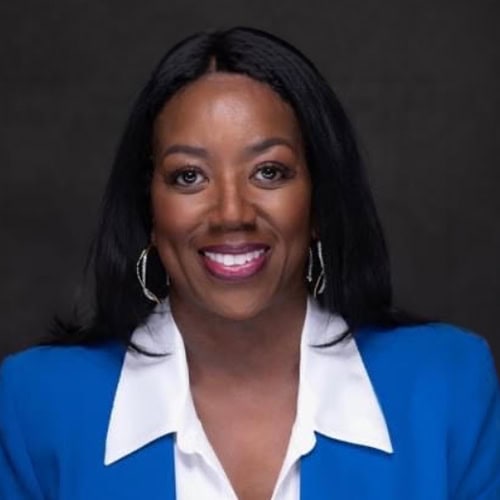 Professional woman representing South Shore CDC in a blue blazer.
